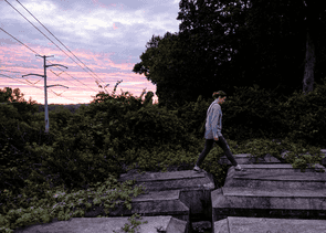 Person walking on grave stones